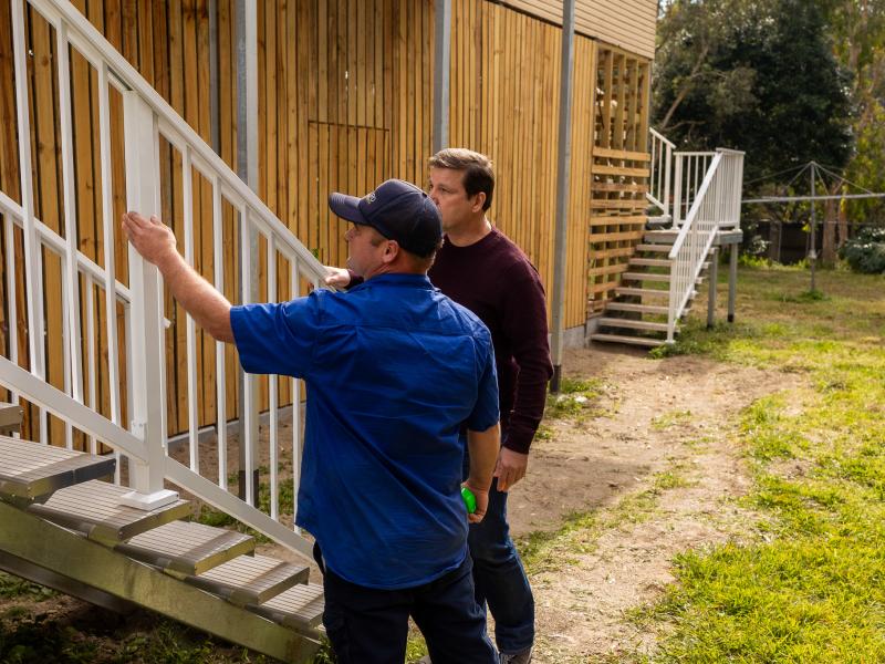 Homeowner talking to a builder